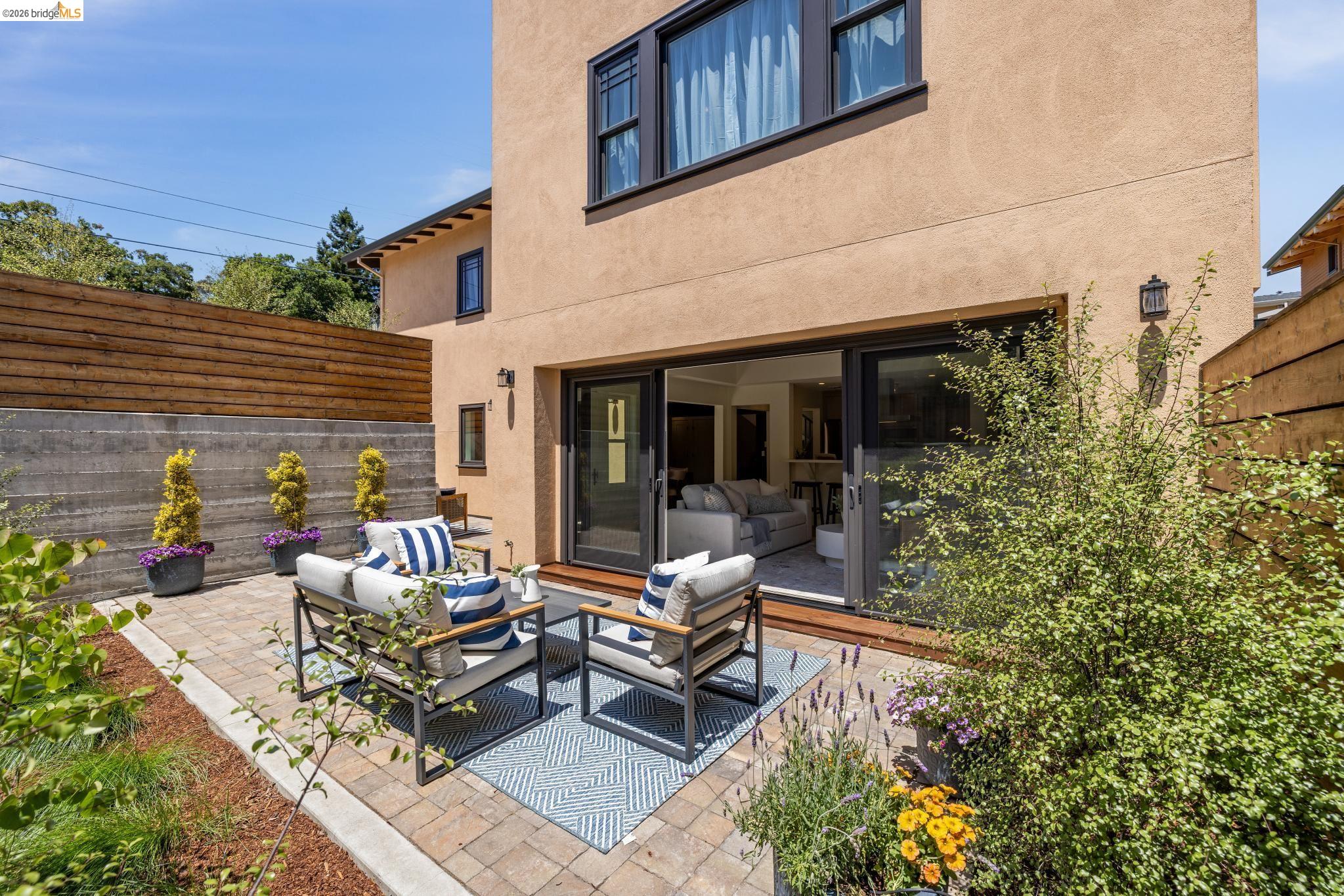 4430 Howe Street Oakland, CA 94611 - Photo 15 of 58 a building outdoor space with patio furniture and potted plants