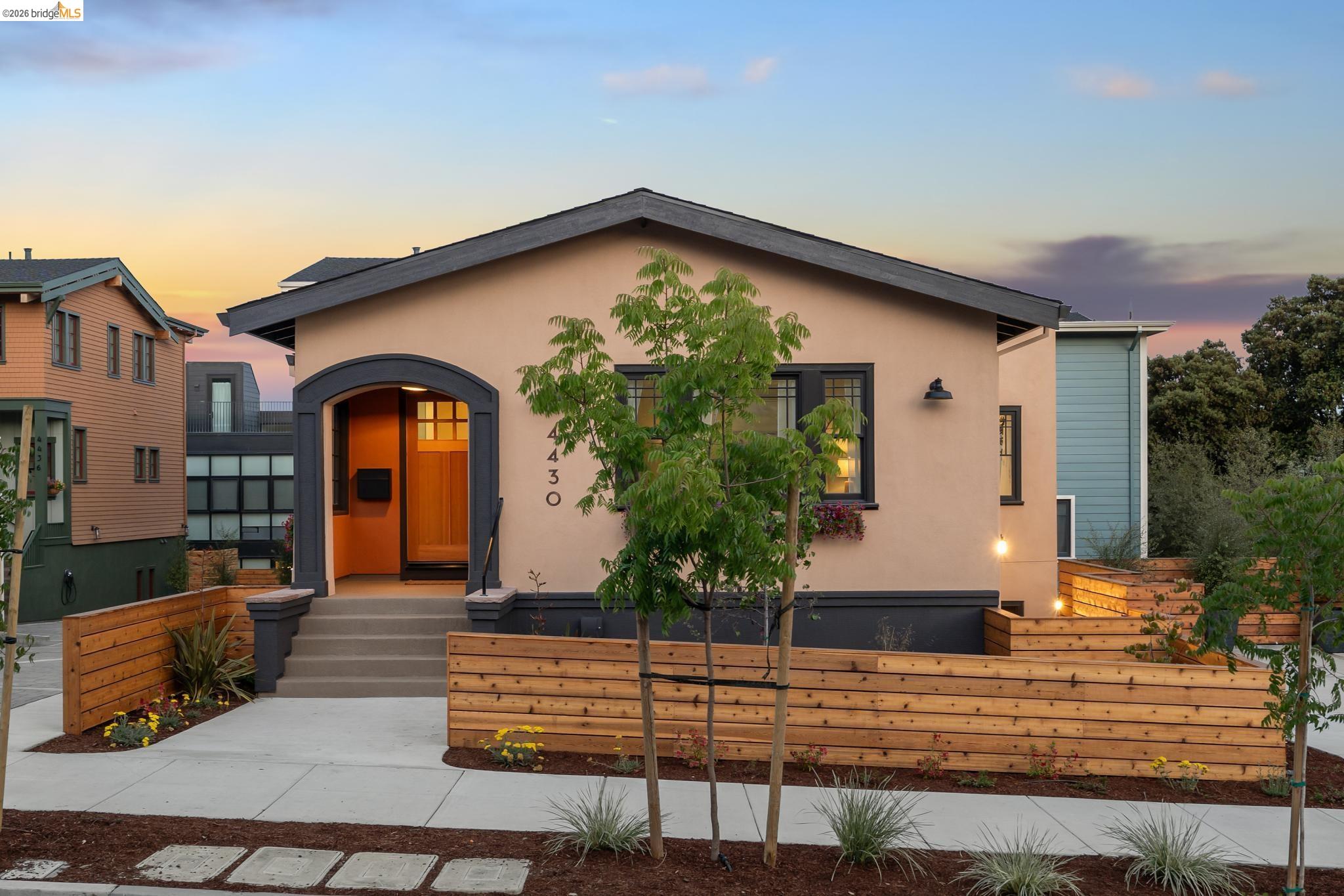 4430 Howe Street Oakland, CA 94611 - Photo 2 of 58 a front view of a house with garden