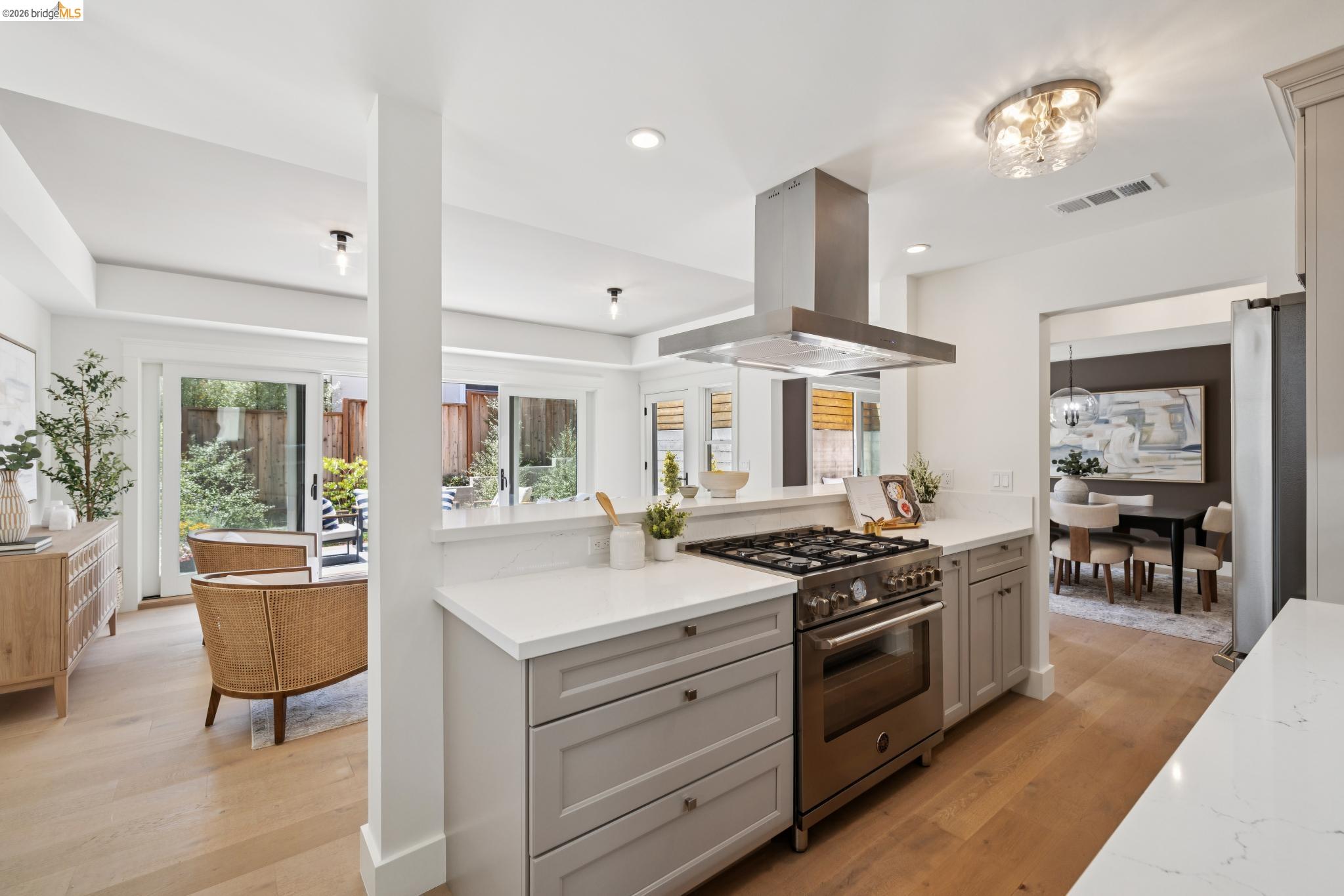 4430 Howe Street Oakland, CA 94611 - Photo 25 of 58 a kitchen with stainless steel appliances a stove a sink and a refrigerator