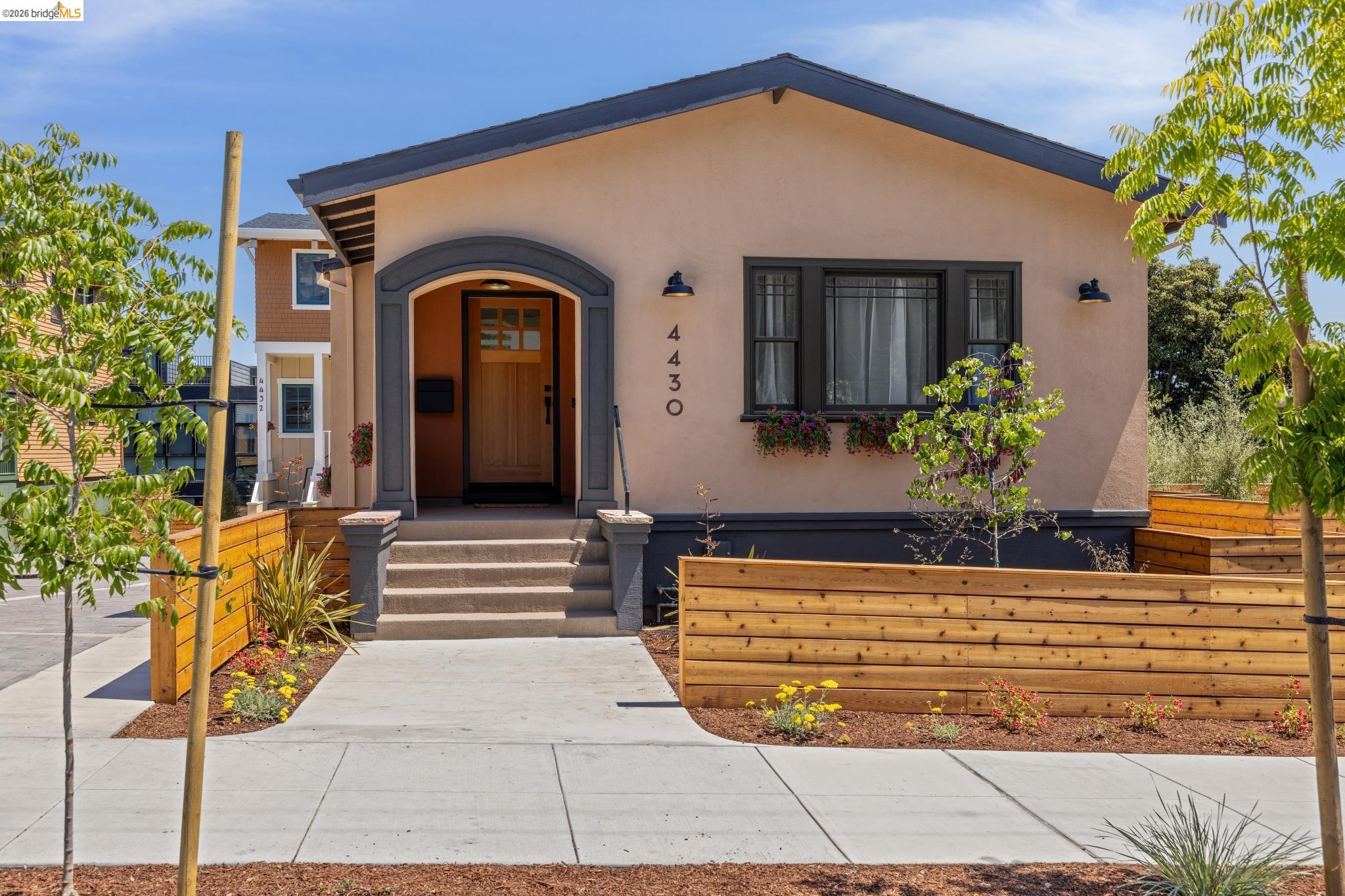 4430 Howe Street Oakland, CA 94611 - Photo 3 of 58 a front view of a house with a yard