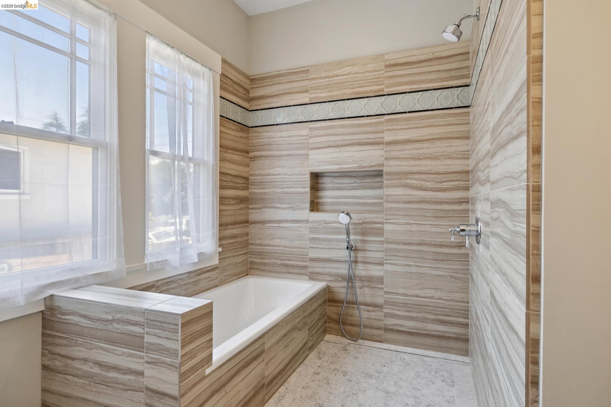 4430 Howe Street Oakland, CA 94611 - Photo 38 of 58 a bathroom with a tub and shower