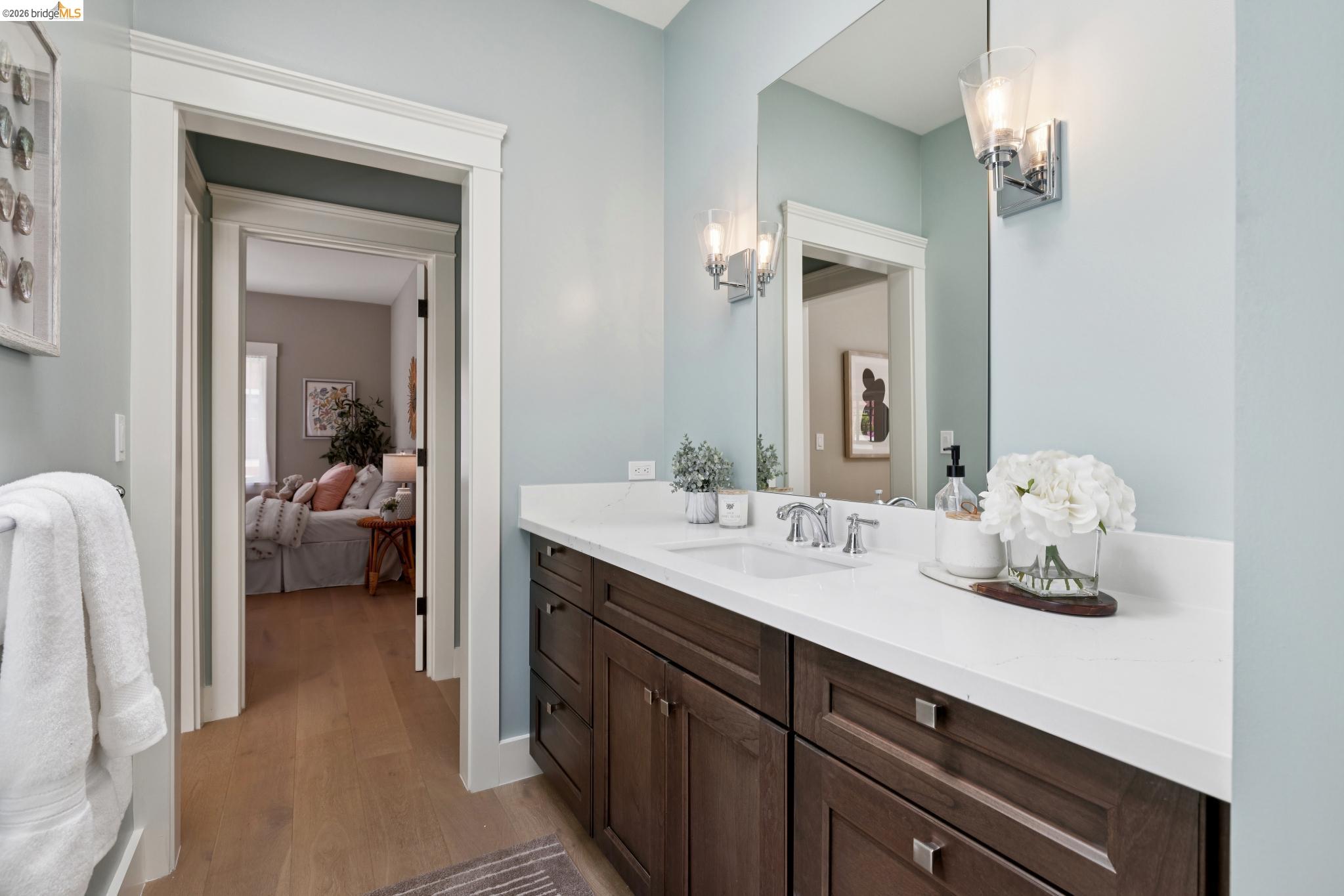 4430 Howe Street Oakland, CA 94611 - Photo 47 of 58 a en suite bathroom with a double vanity sink and mirror