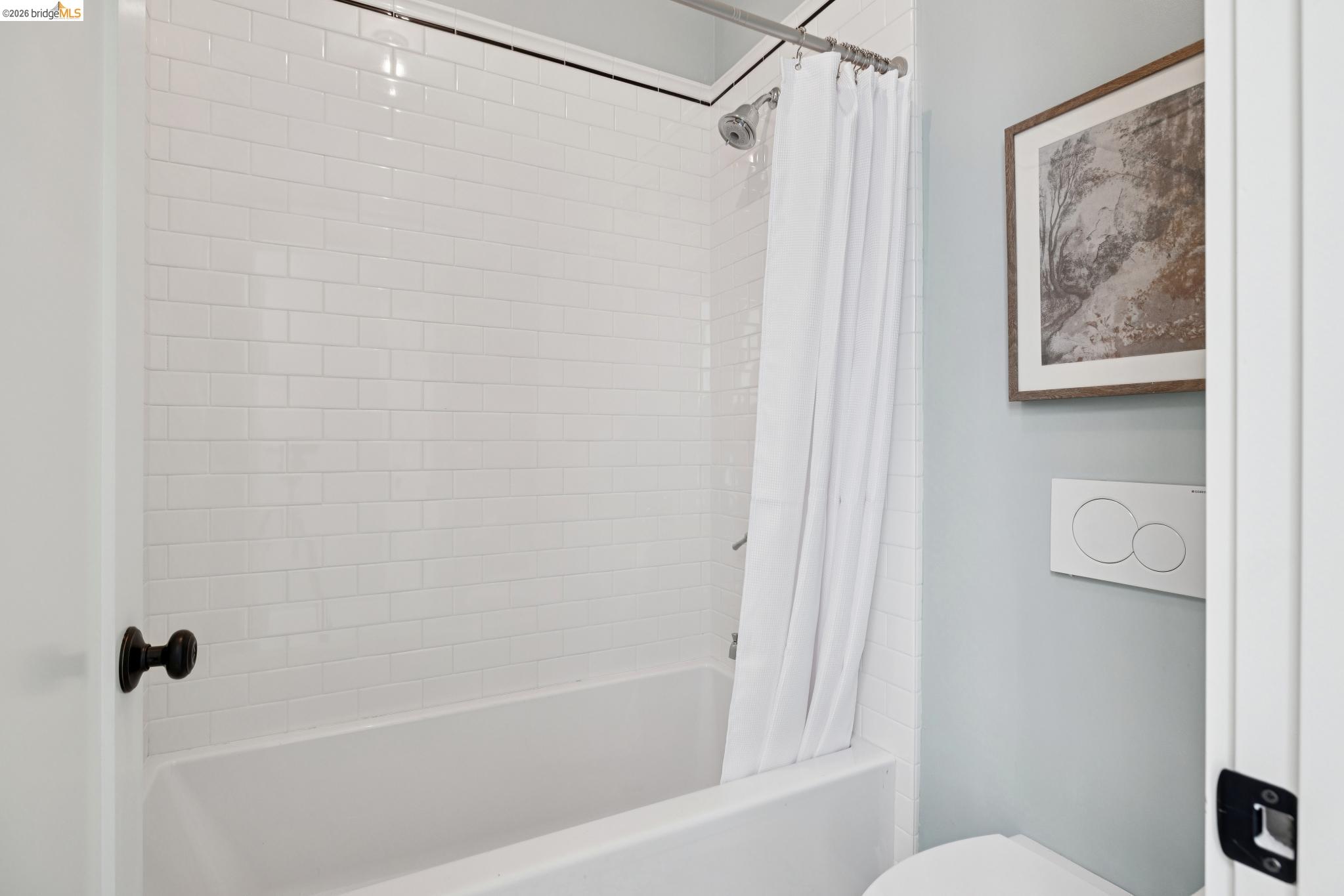 4430 Howe Street Oakland, CA 94611 - Photo 48 of 58 a bathroom with a shower and a toilet