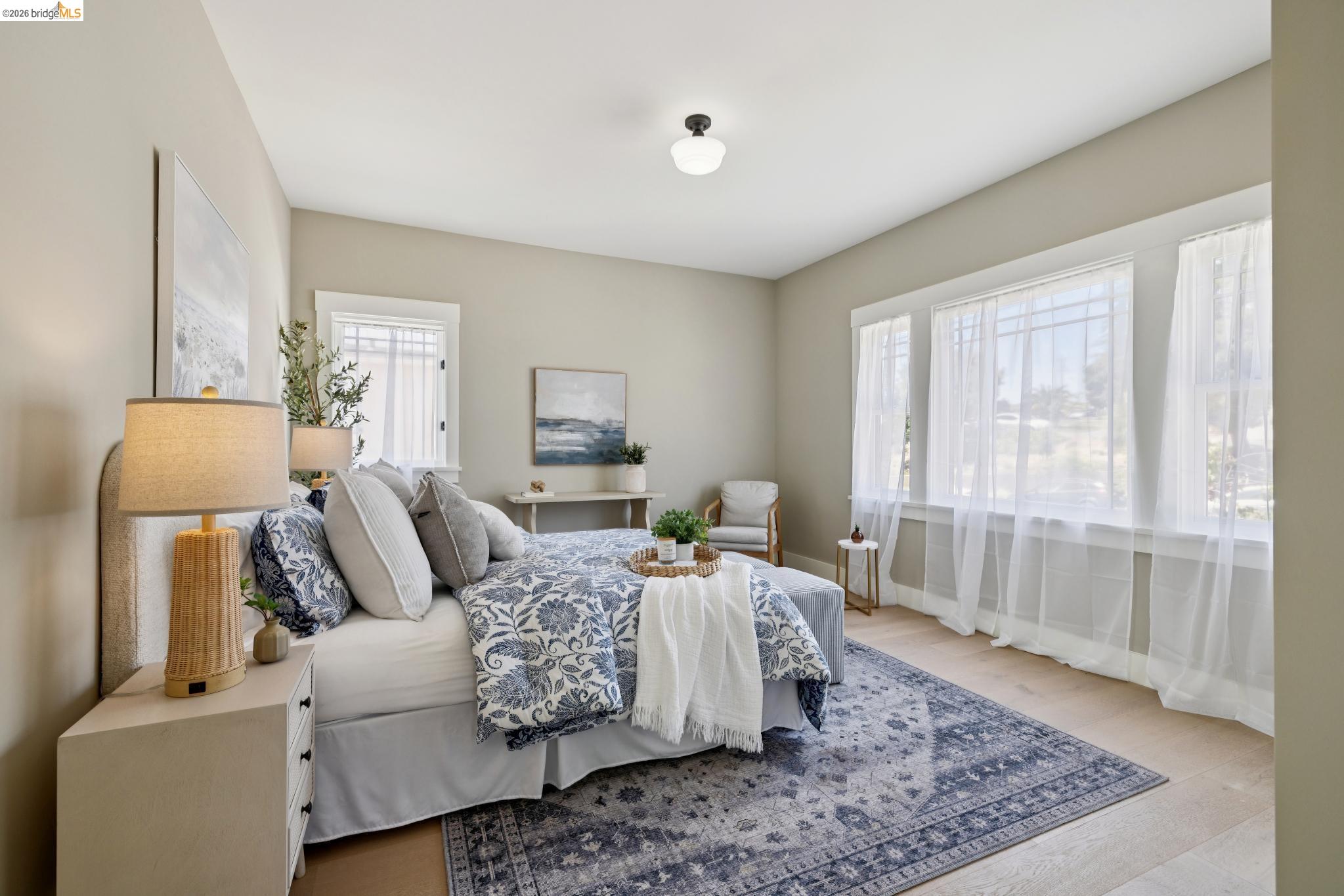 4430 Howe Street Oakland, CA 94611 - Photo 50 of 58 a bedroom with a bed and wooden floor
