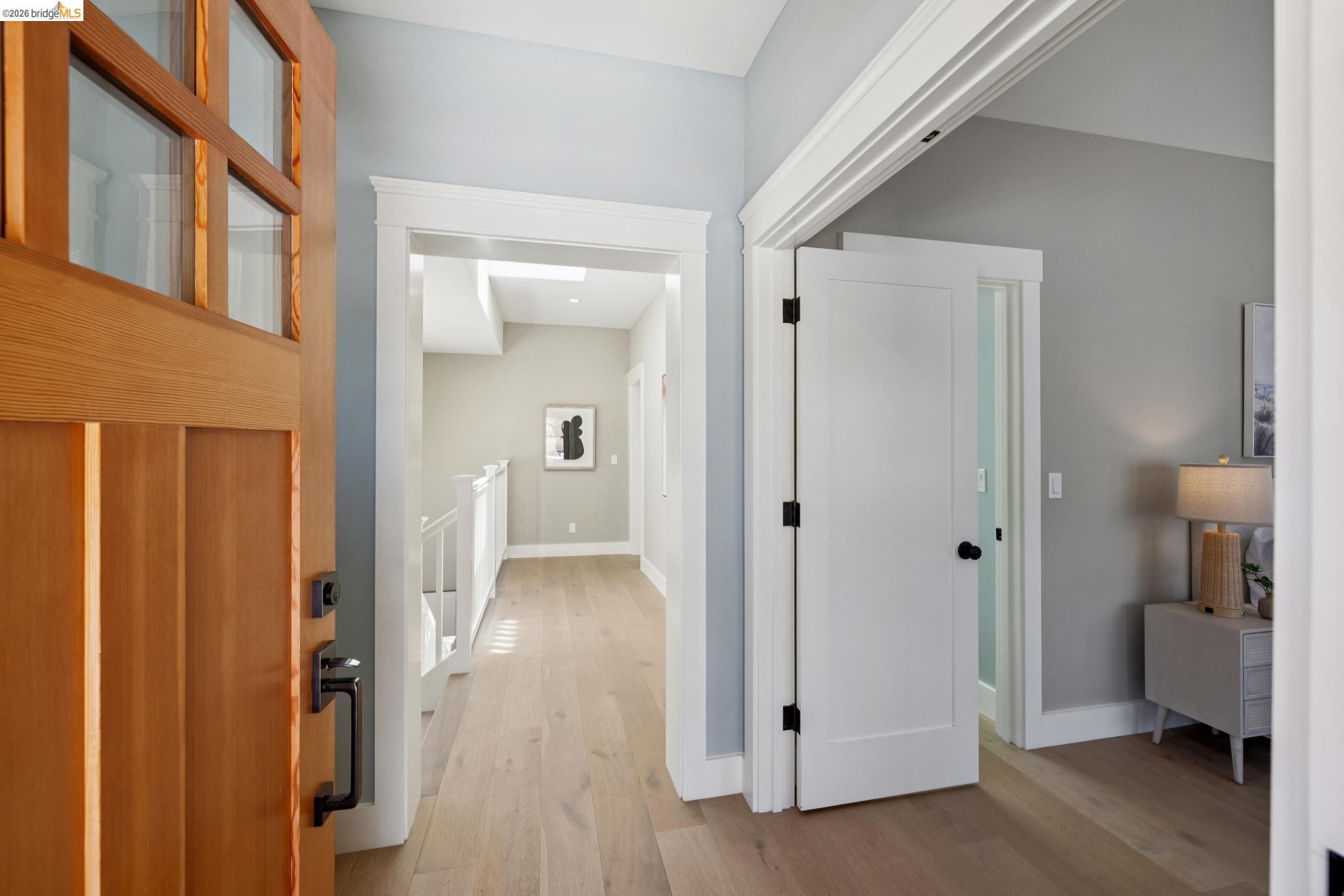 4430 Howe Street Oakland, CA 94611 - Photo 5 of 58 a view of a hallway with bathroom and wooden floor