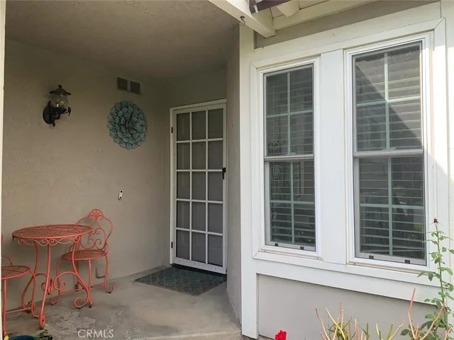 a view of chair and table in a room