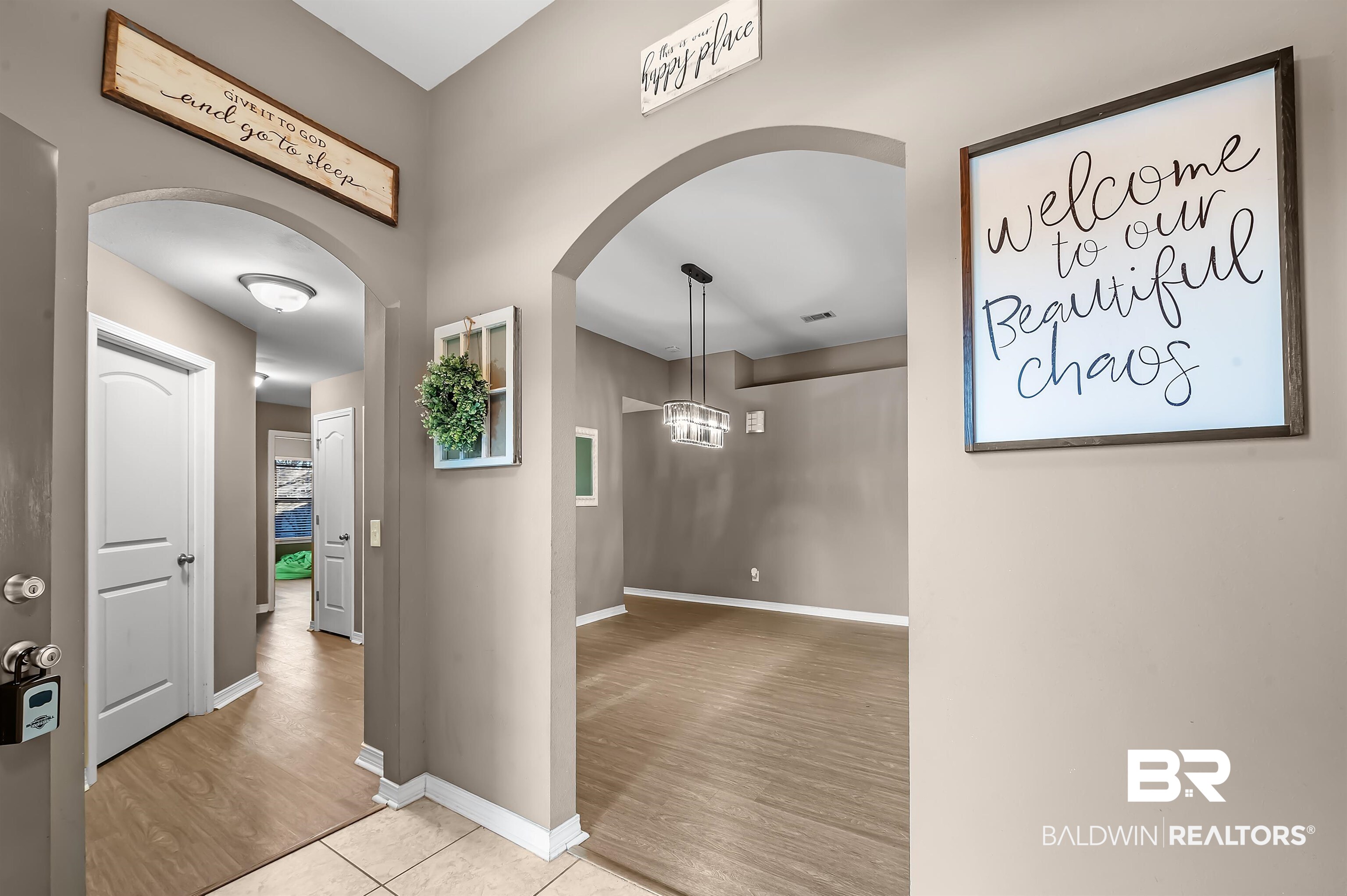229 Meadow Run Loop East Foley, AL 36535 - Photo 9 of 31 Hallway with light hardwood / wood-style flooring and a notable chandelier