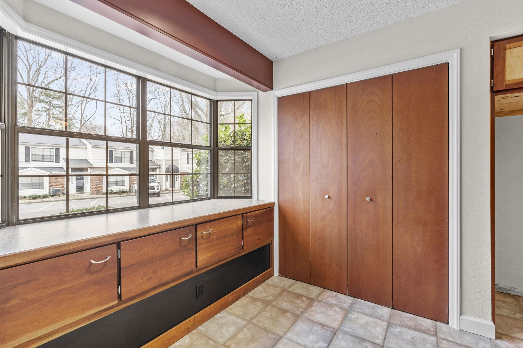 7820 Falcon Rest Circle, Unit 7820 Raleigh, NC 27615 - Photo 7 of 32 Laundry and Bay Window Storage