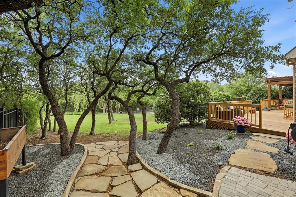 502 Prairie Run Aledo, TX 76008 - Photo 26 of 37 Custom paths throughout the home's back yard
