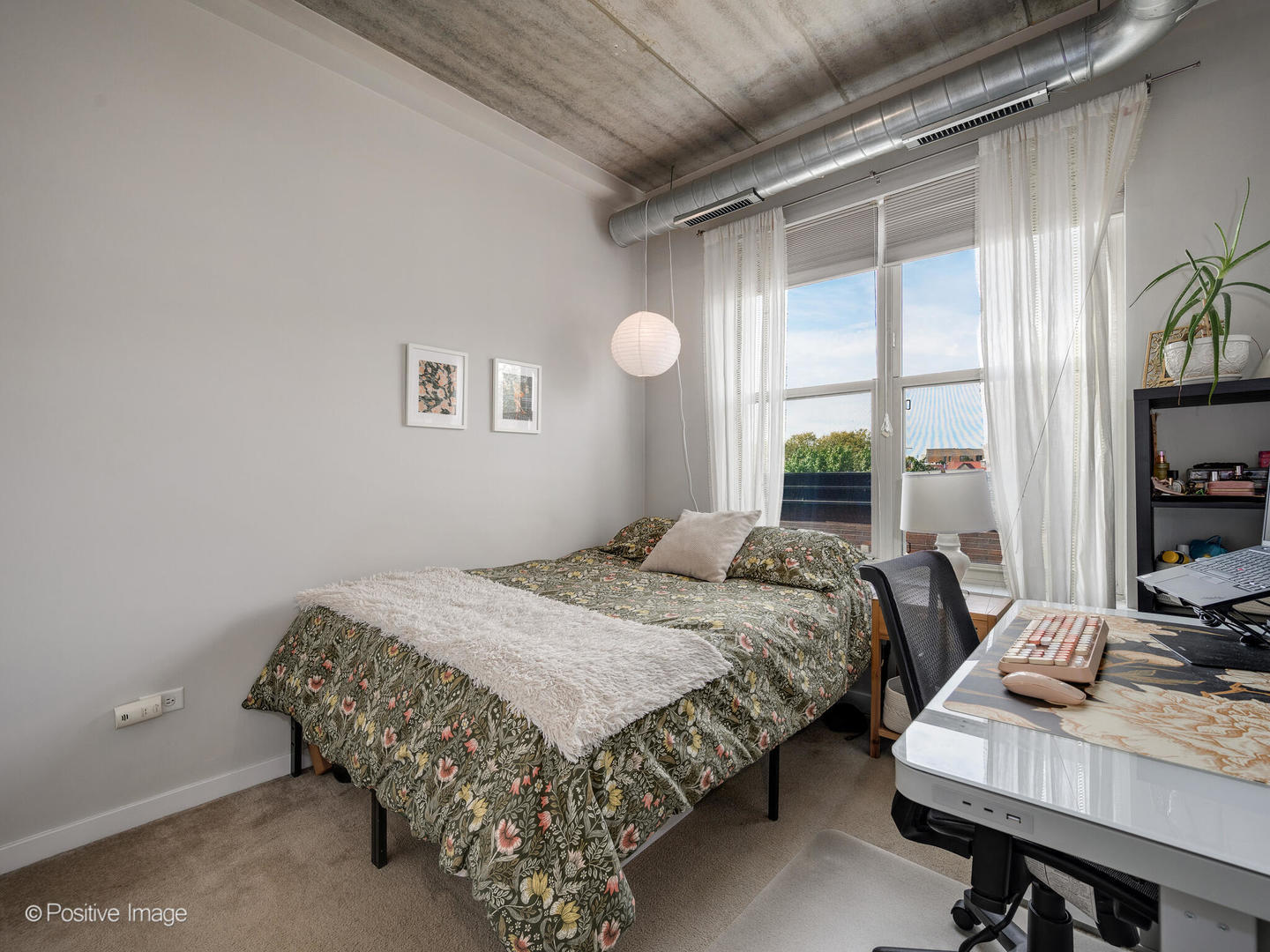 1228 West Monroe Street, Unit 408 Chicago, IL 60607 - Photo 13 of 17 a bedroom with a bed and a window