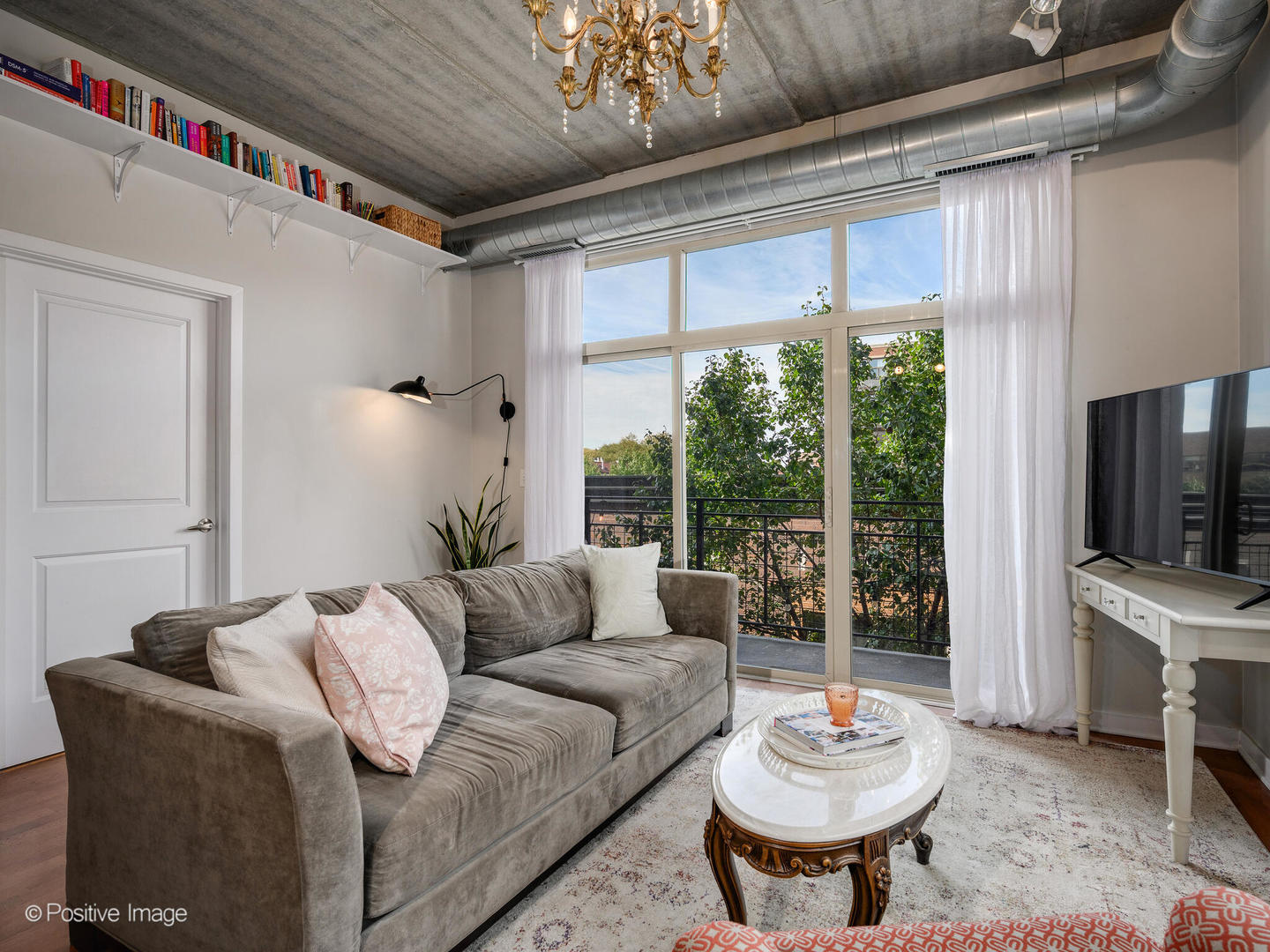 1228 West Monroe Street, Unit 408 Chicago, IL 60607 - Photo 4 of 17 a living room with furniture and a flat screen tv