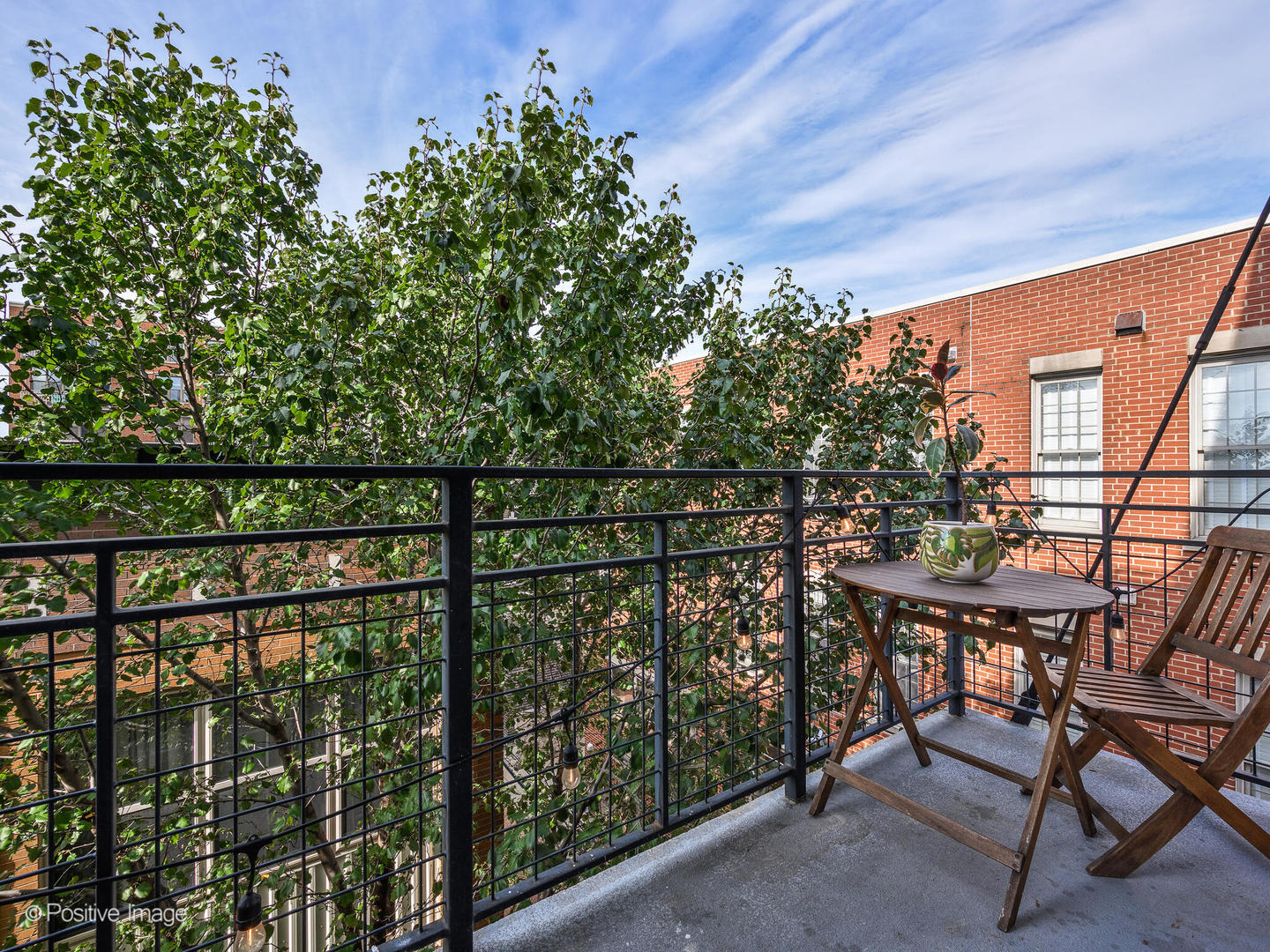 1228 West Monroe Street, Unit 408 Chicago, IL 60607 - Photo 7 of 17 a view of a chairs and table in the balcony