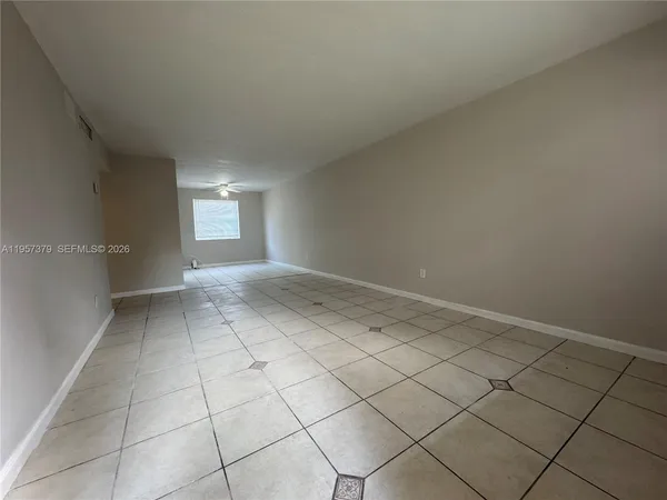 a view of an empty room and window