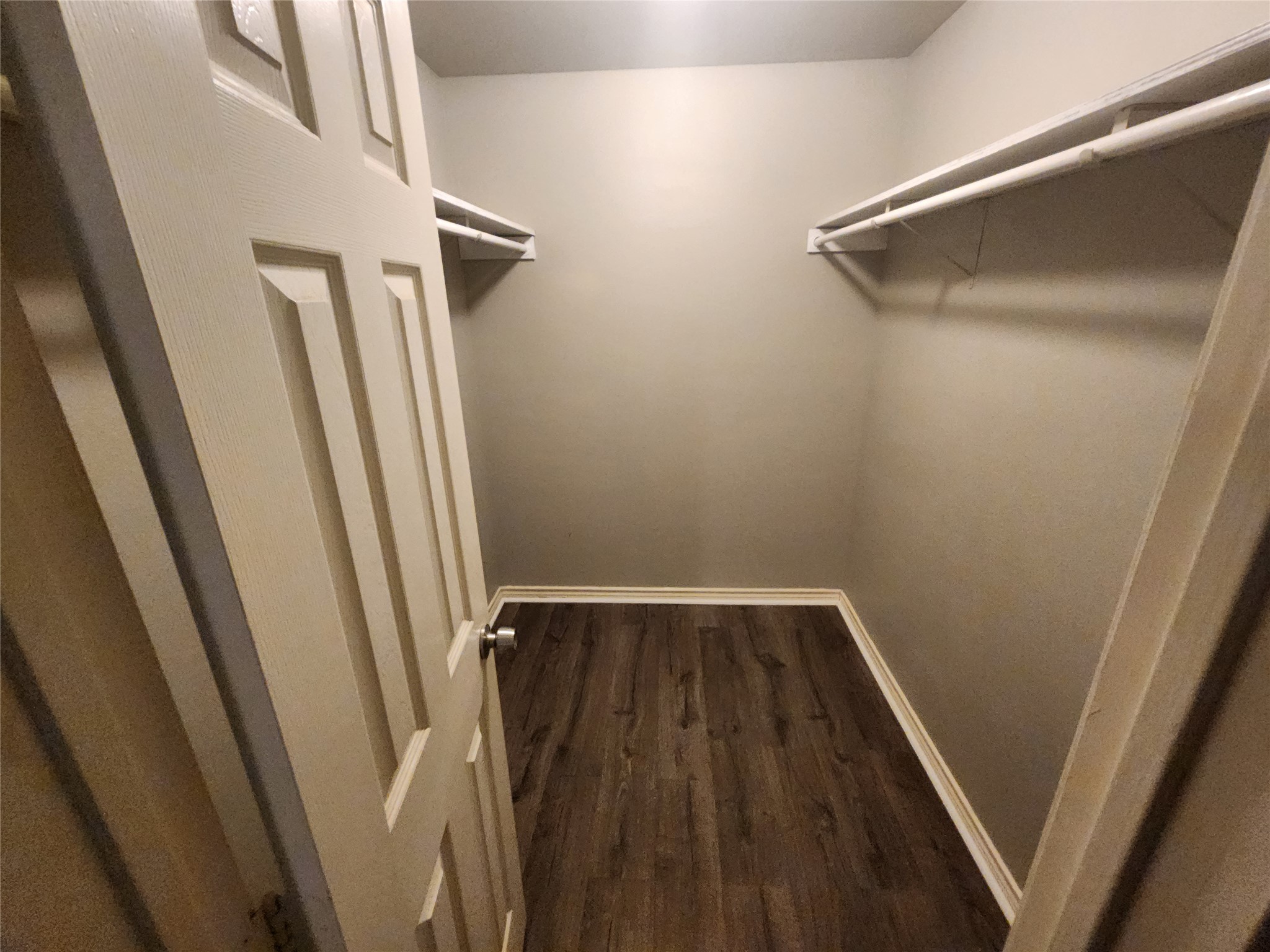 2714 Whitis Avenue, Unit ABC Austin, TX 78705 - Photo 23 of 24 Walk in closet featuring dark wood-style flooring