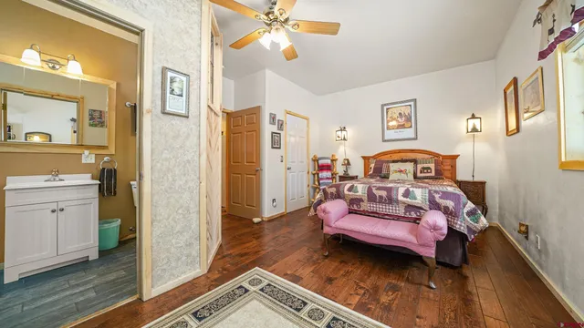 a bathroom with a sink vanity mirror and toilet