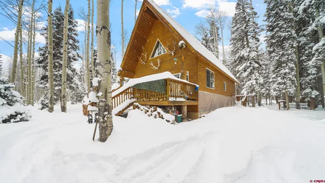 a balcony with table and chairs