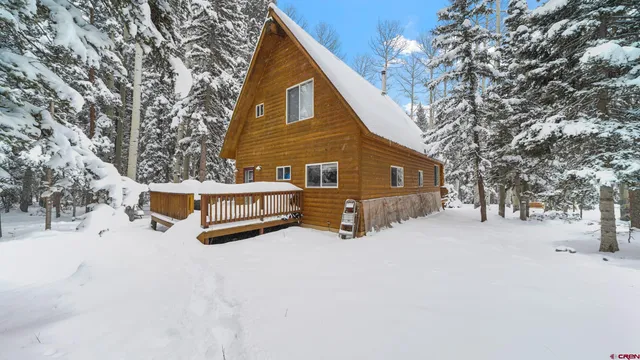 a view of a house with a snow on the yard