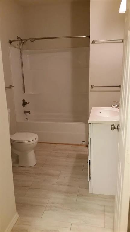 304 Fulton Street, Unit A Denton, TX 76201 - Photo 12 of 17 a bathroom with a shower and a toilet