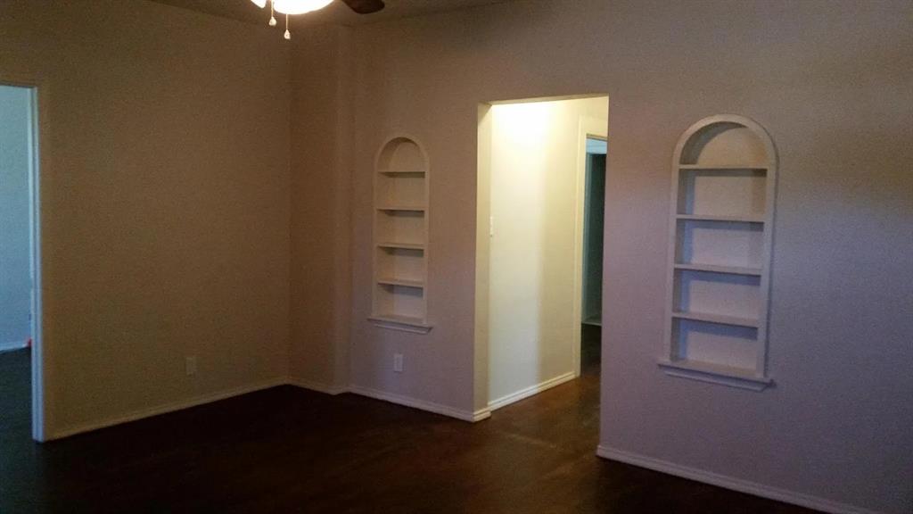 304 Fulton Street, Unit A Denton, TX 76201 - Photo 14 of 17 an empty room with closet