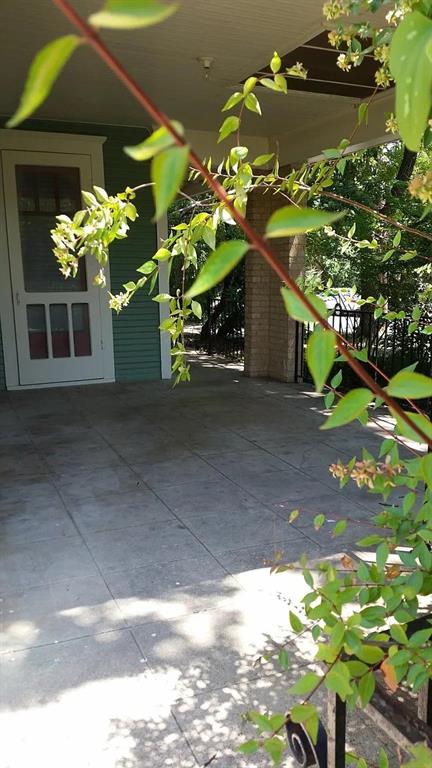 304 Fulton Street, Unit A Denton, TX 76201 - Photo 3 of 17 a vase of flowers sitting on a floor