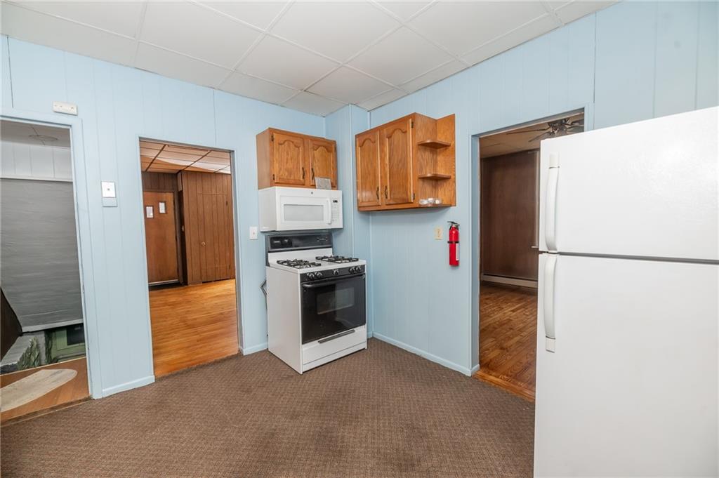 755 Morris Street Clymer, PA 15728 - Photo 18 of 22 a kitchen with stainless steel appliances a refrigerator sink and stove