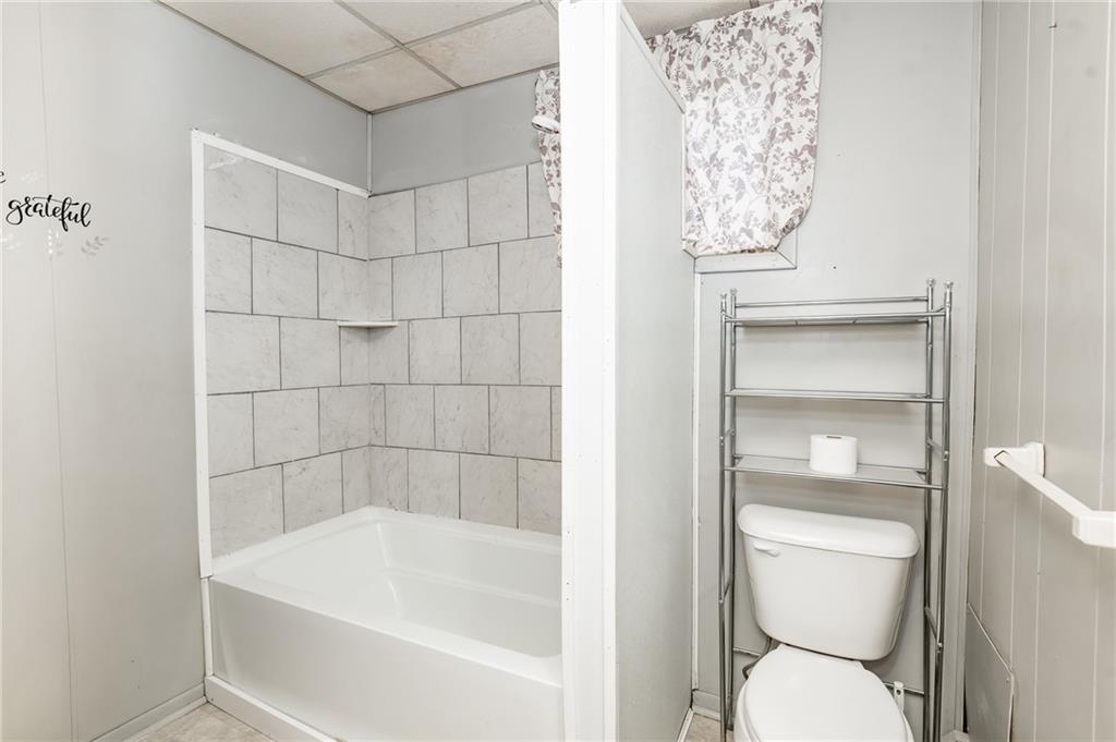755 Morris Street Clymer, PA 15728 - Photo 20 of 22 a a white bath tub sitting next to a toilet