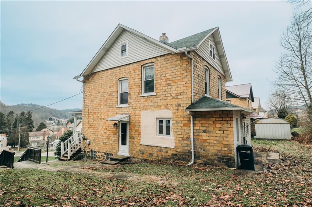 755 Morris Street Clymer, PA 15728 - Photo 3 of 22 a view of a house with a yard