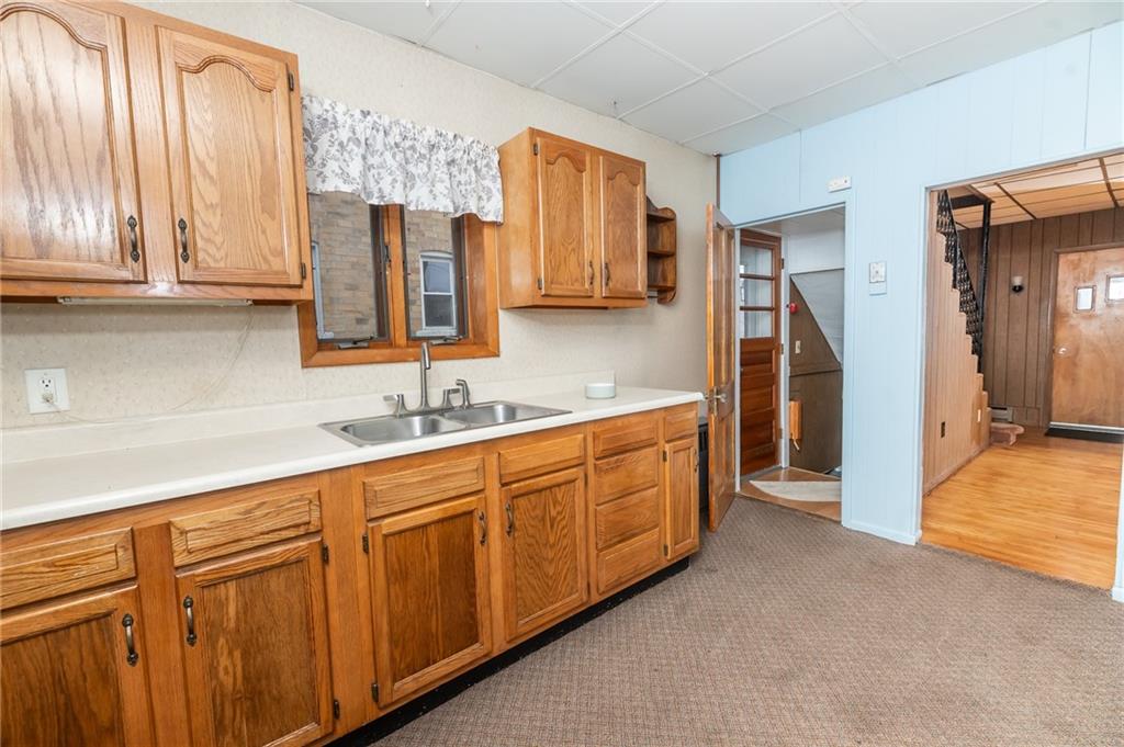 755 Morris Street Clymer, PA 15728 - Photo 10 of 22 a spacious bathroom with a double vanity sink a mirror and a shower