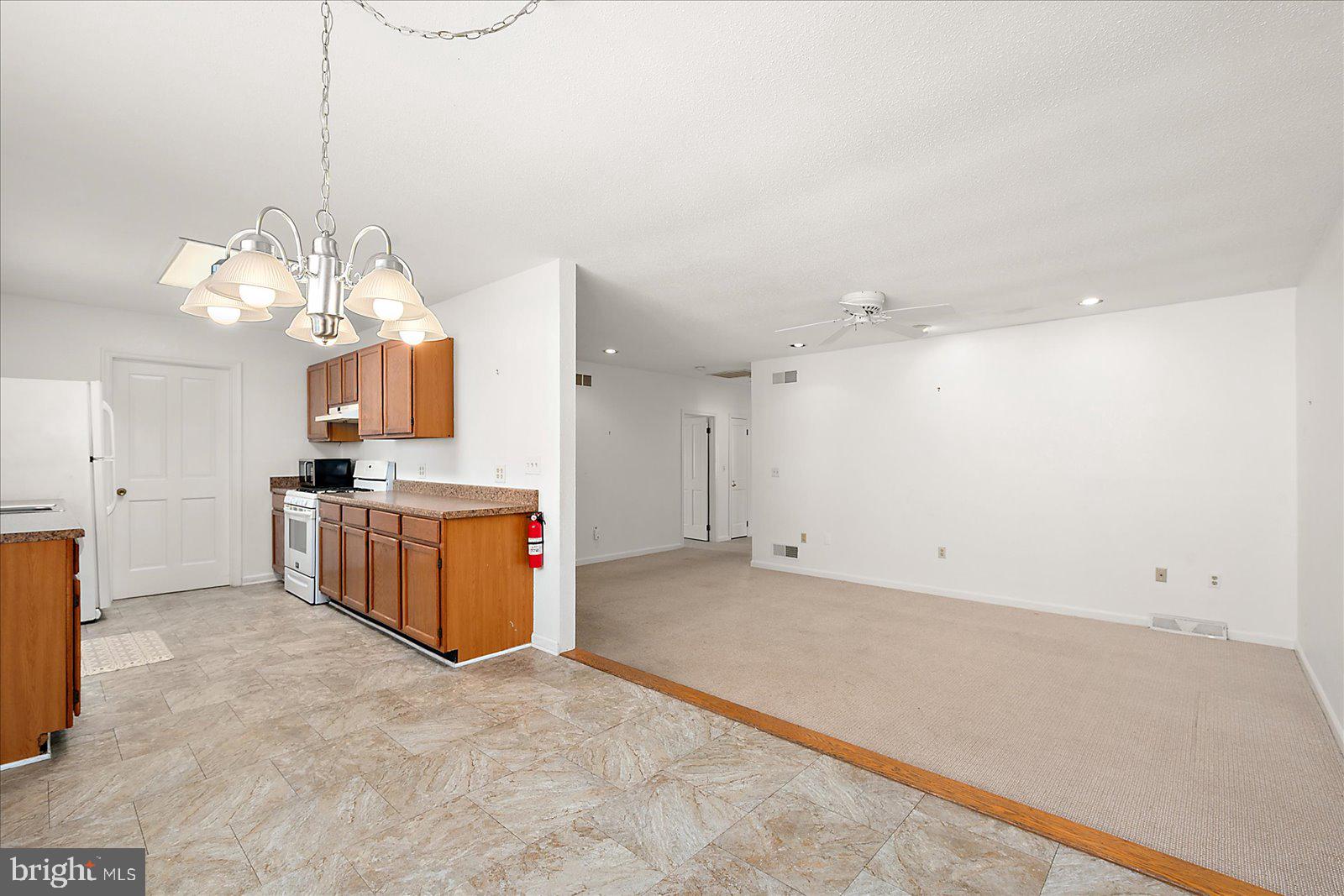10505 Keyser Point Road Ocean City, MD 21842 - Photo 16 of 53 a large white kitchen with a window