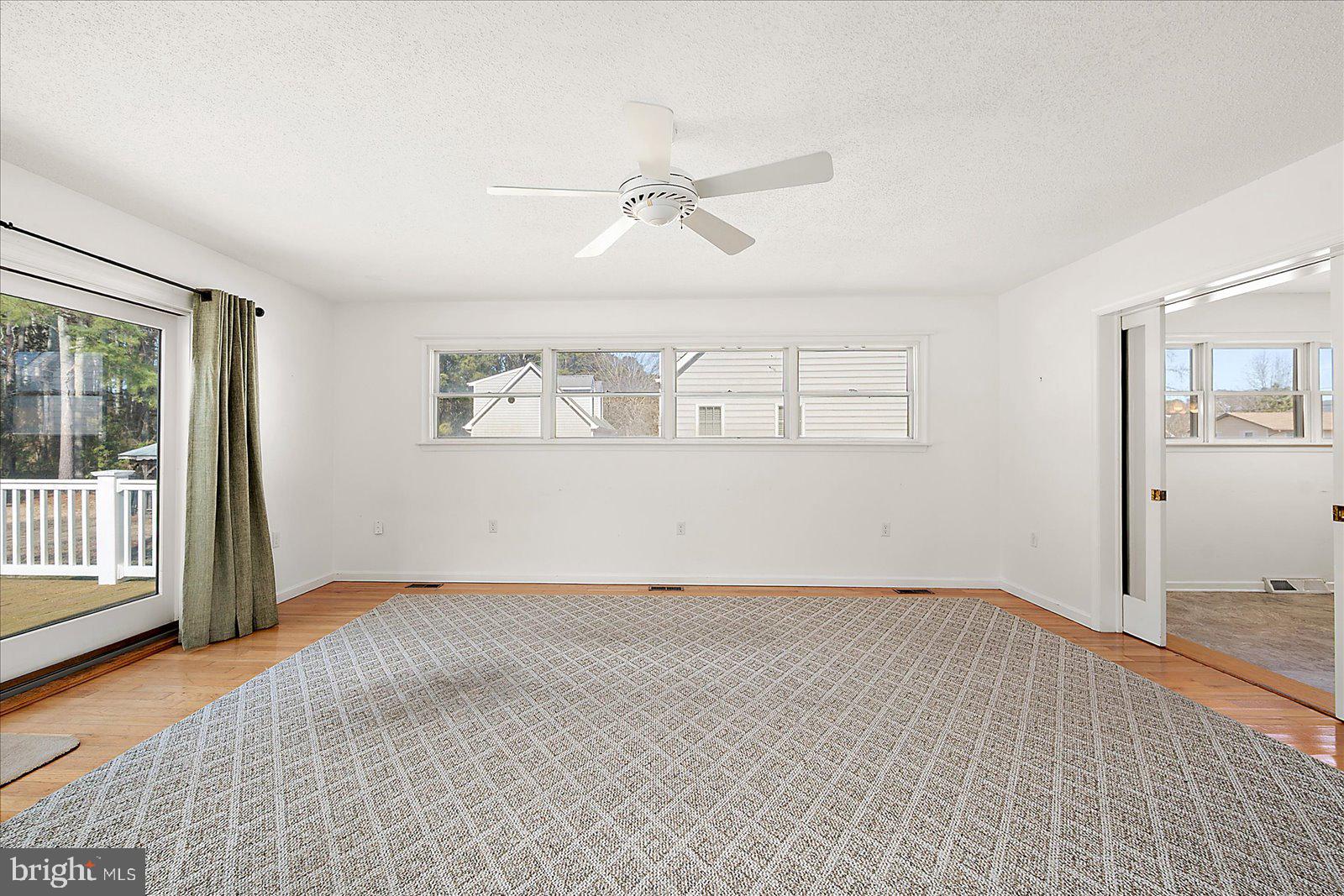 10505 Keyser Point Road Ocean City, MD 21842 - Photo 27 of 53 wooden floor in an empty room with a window
