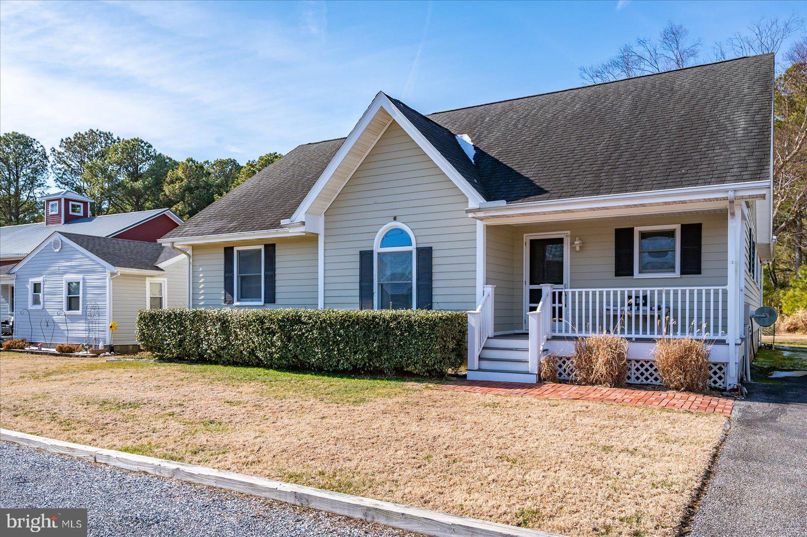 10505 Keyser Point Road Ocean City, MD 21842 - Photo 3 of 53 a front view of a house with a yard