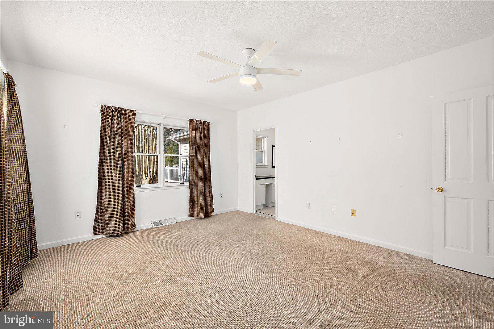 10505 Keyser Point Road Ocean City, MD 21842 - Photo 31 of 53 an empty room with closet and a ceiling fan