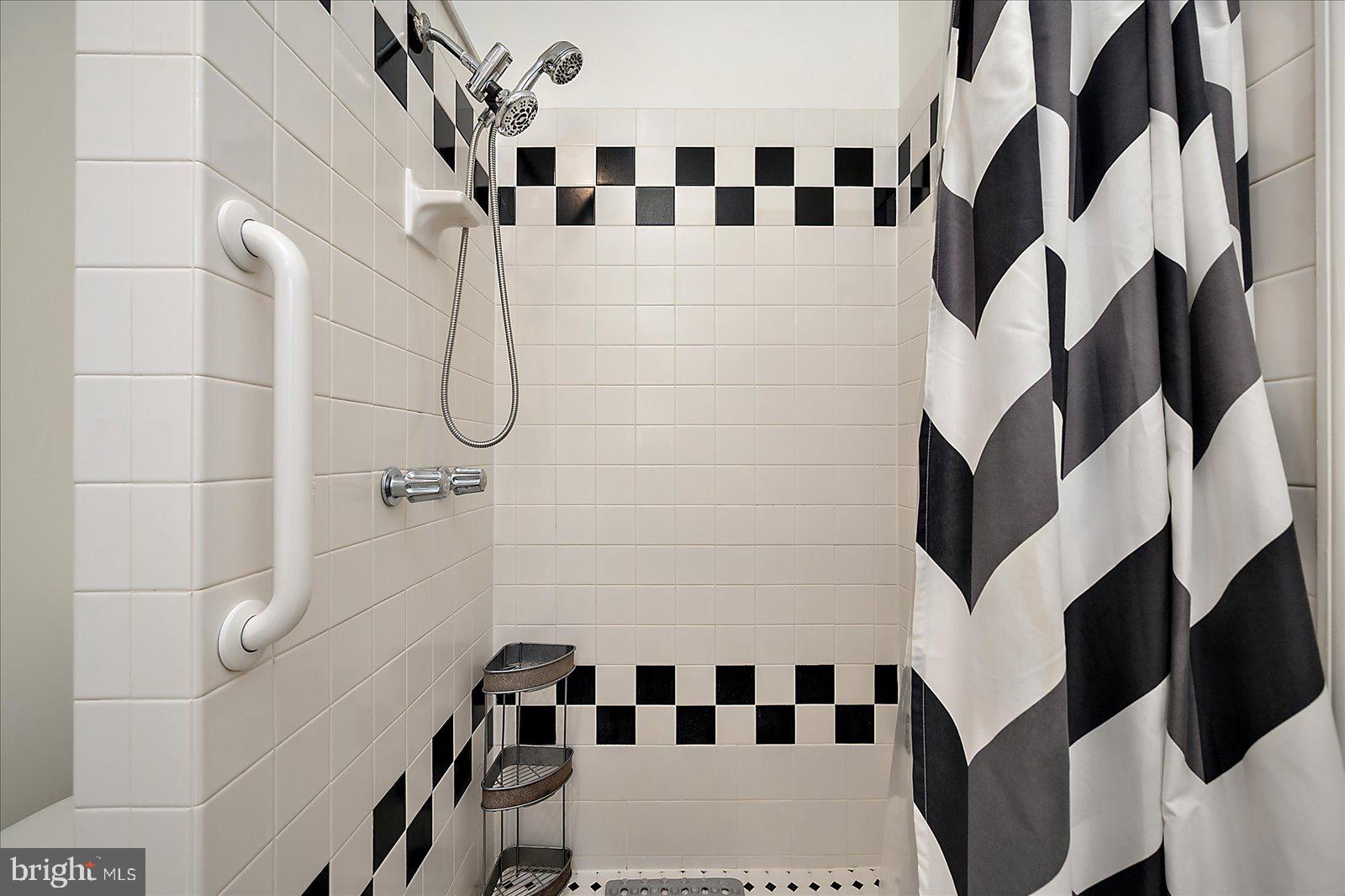 10505 Keyser Point Road Ocean City, MD 21842 - Photo 34 of 53 a bathroom with a bathtub and shower