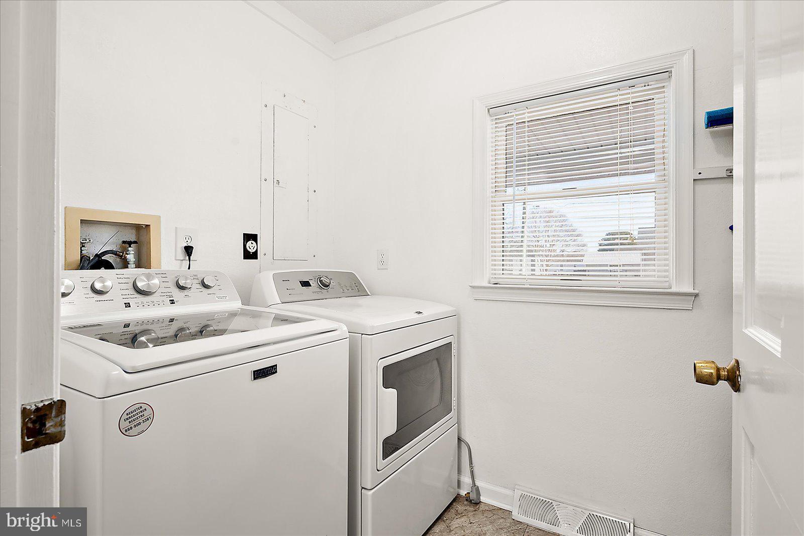 10505 Keyser Point Road Ocean City, MD 21842 - Photo 42 of 53 a utility room with dryer and washer