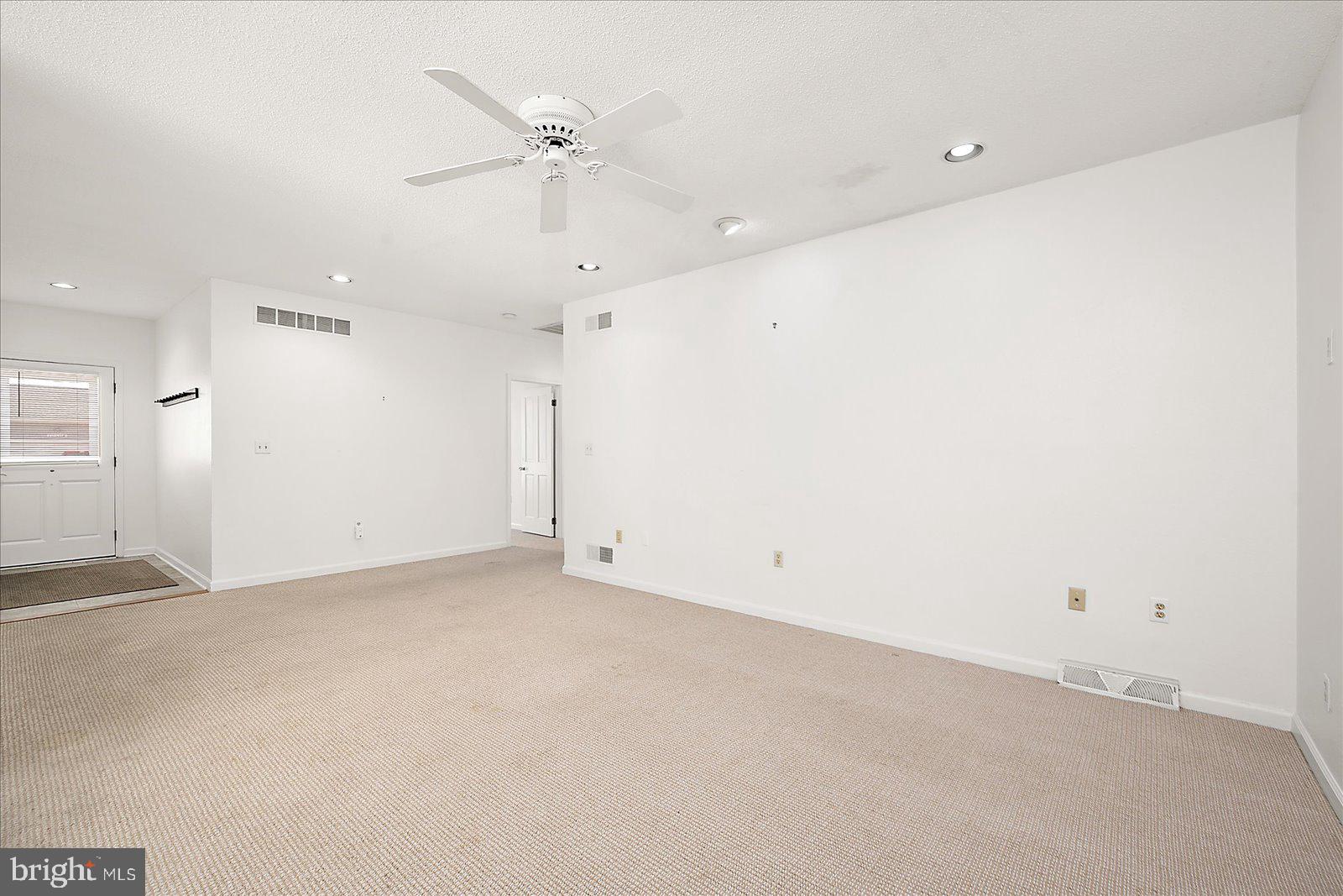 10505 Keyser Point Road Ocean City, MD 21842 - Photo 10 of 53 an empty room with a ceiling fan and a window