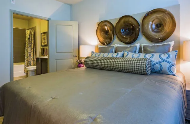 a bedroom with bed and a window