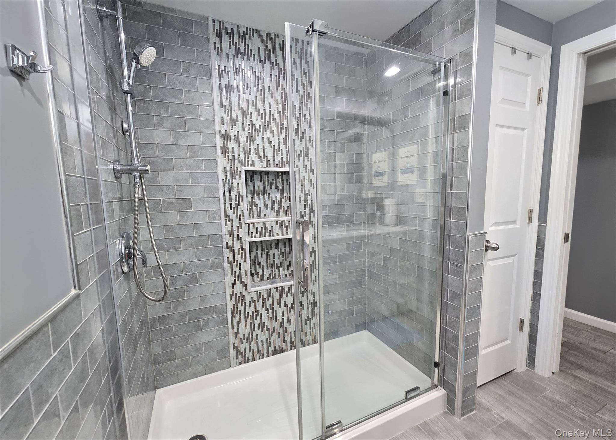 430 Heathcote Road Lindenhurst, NY 11757 - Photo 13 of 22 a bathroom with a shower and a bathtub