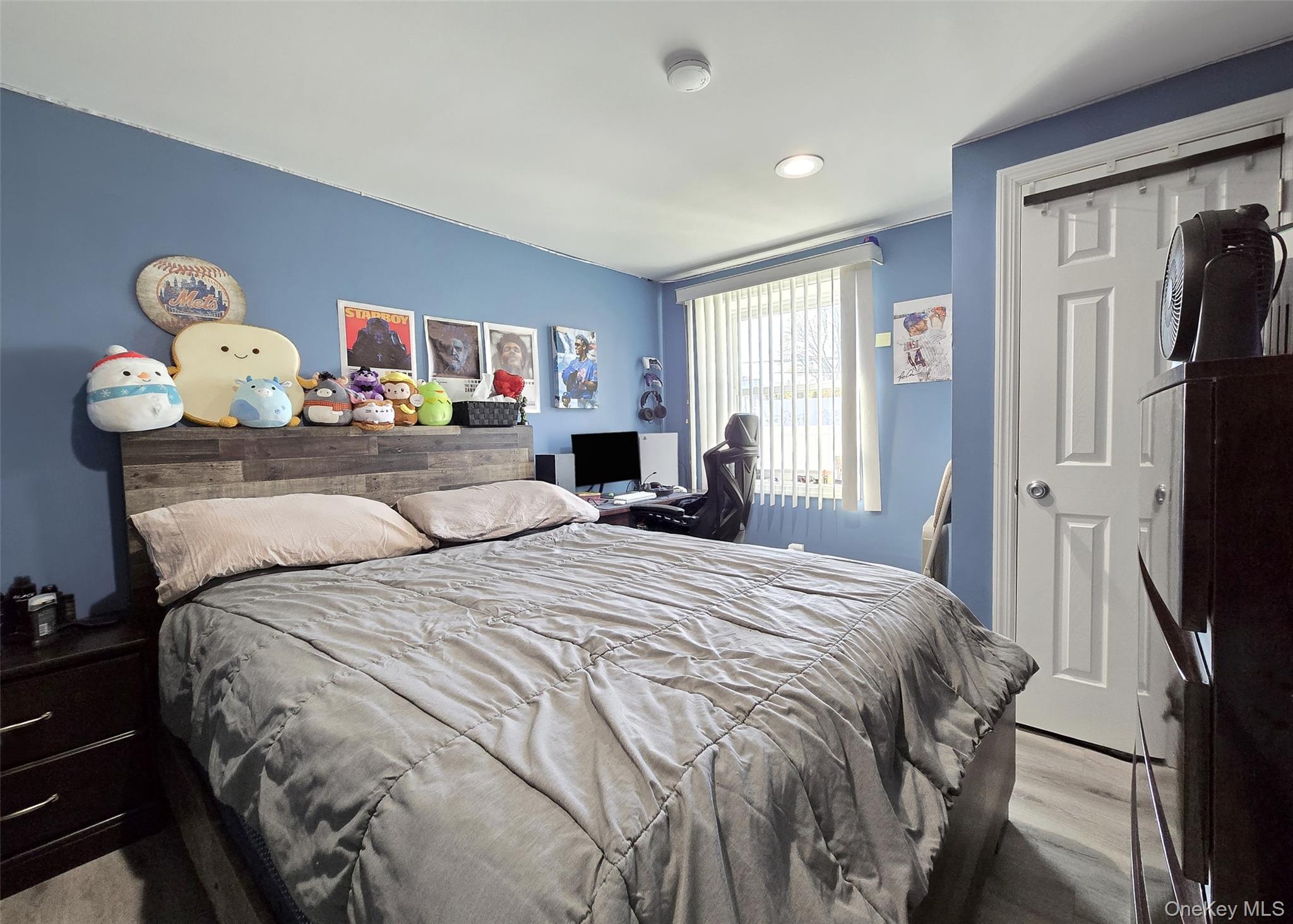 430 Heathcote Road Lindenhurst, NY 11757 - Photo 16 of 22 a bedroom with a bed and a tv in it