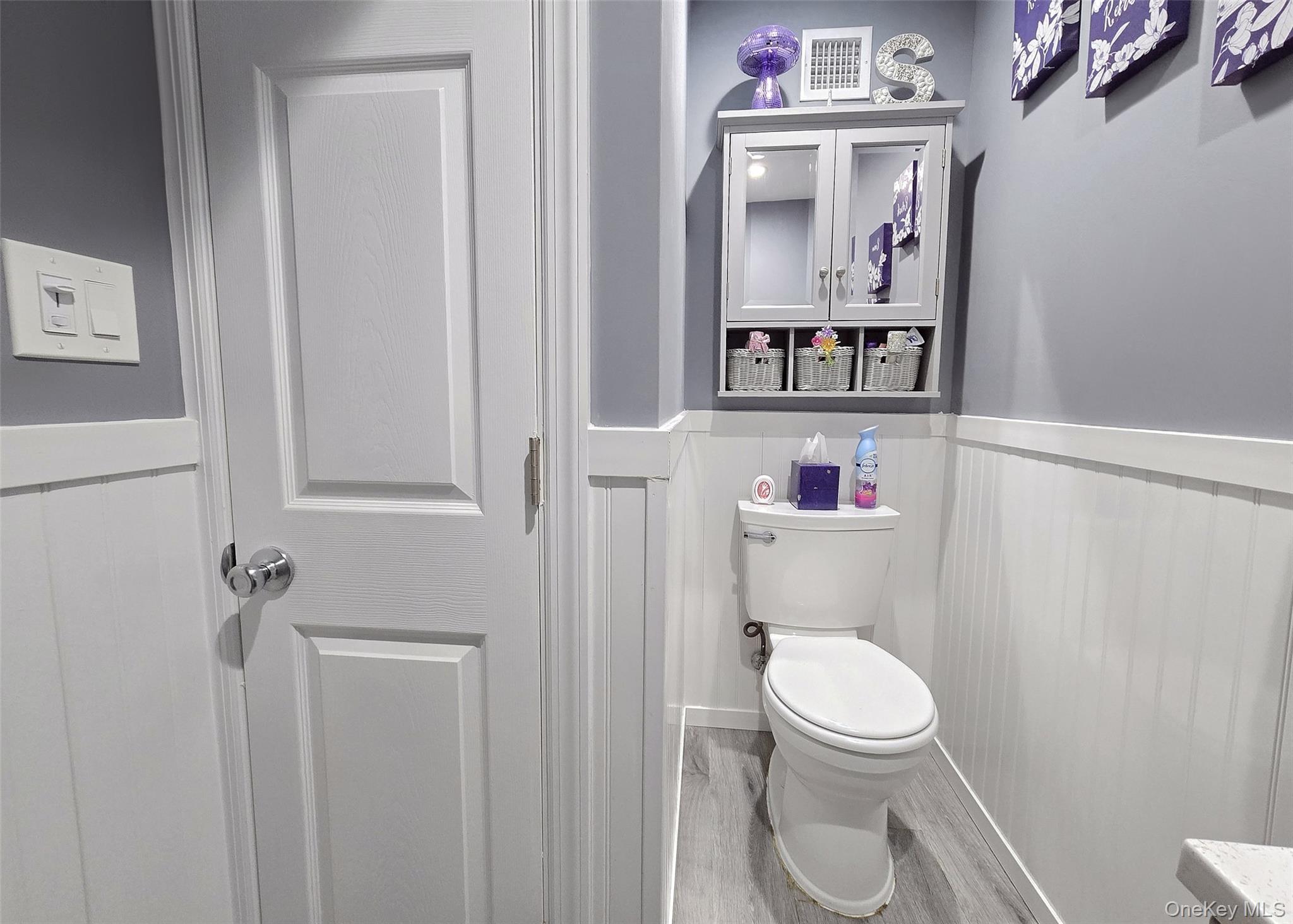 430 Heathcote Road Lindenhurst, NY 11757 - Photo 20 of 22 a white toilet sitting next to a bathroom sink