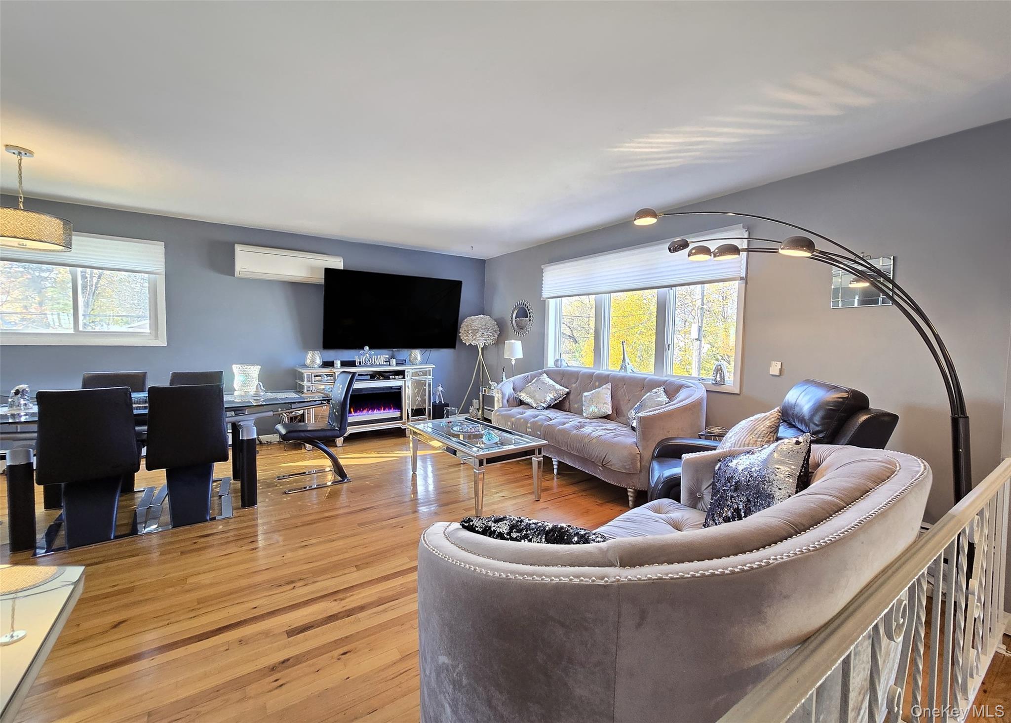 430 Heathcote Road Lindenhurst, NY 11757 - Photo 2 of 22 a living room with furniture and a flat screen tv