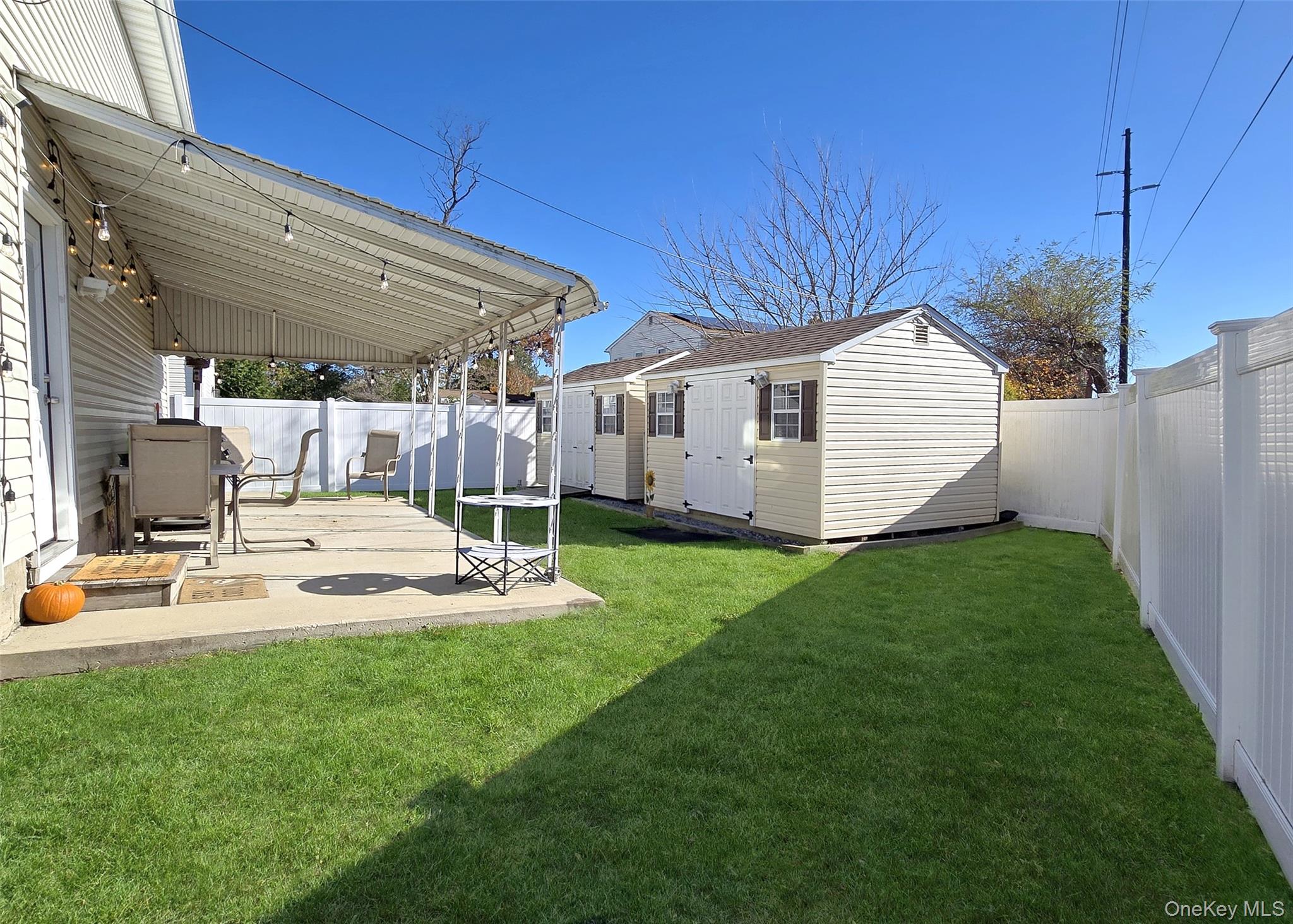 430 Heathcote Road Lindenhurst, NY 11757 - Photo 22 of 22 a view of a backyard with backyard