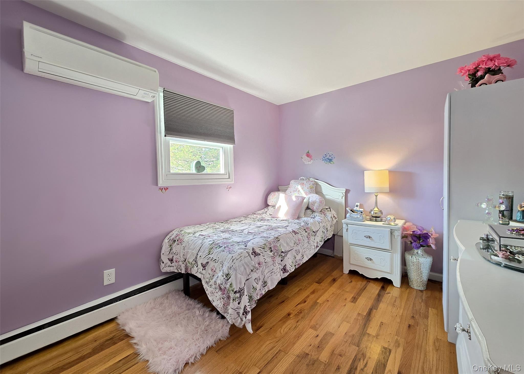 430 Heathcote Road Lindenhurst, NY 11757 - Photo 10 of 22 a bedroom with a bed and a dresser