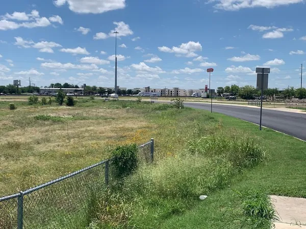 a view of a lake with a big yard