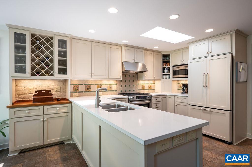 920 Flordon Drive Charlottesville, VA 22901 - Photo 18 of 43 a kitchen with a white cabinets stove and refrigerator
