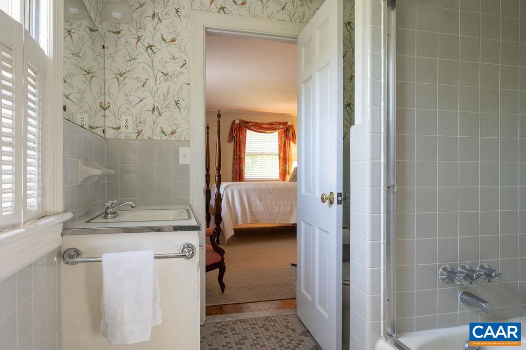 920 Flordon Drive Charlottesville, VA 22901 - Photo 26 of 43 a bathroom with a granite countertop sink a toilet and shower