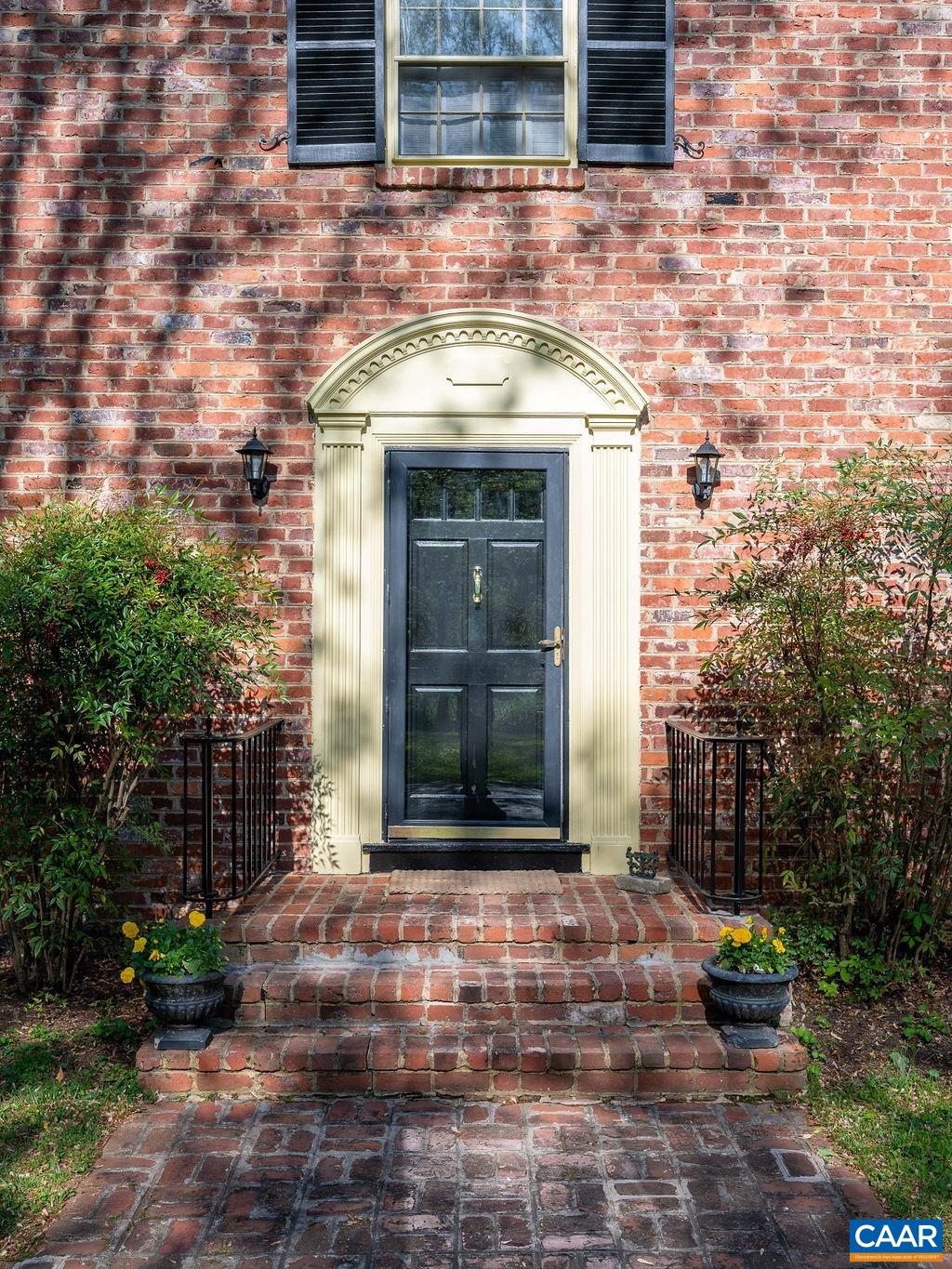 920 Flordon Drive Charlottesville, VA 22901 - Photo 43 of 43 a front view of a house with a garden
