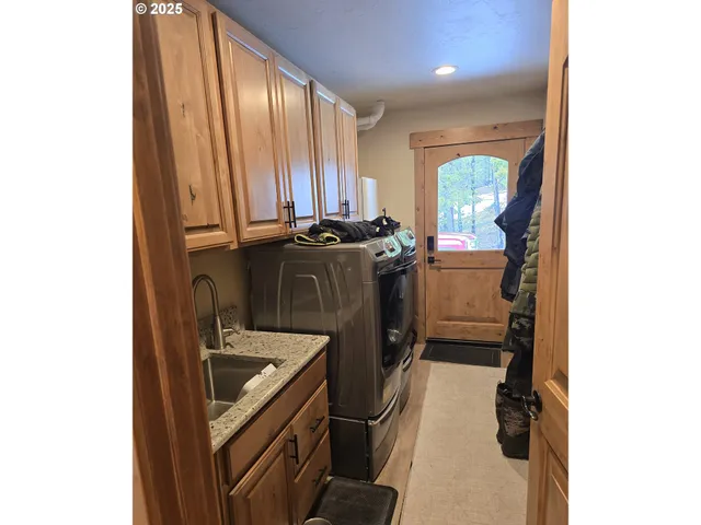 a kitchen with a sink and a refrigerator