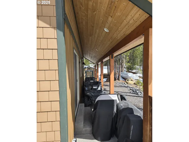 a view of a lake in middle of forest