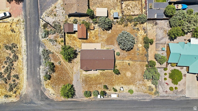 132 Rex Layne Drive Central, UT 84722 - Photo 26 of 39 Single-story residence with a brown shingle roof, positioned on a corner lot