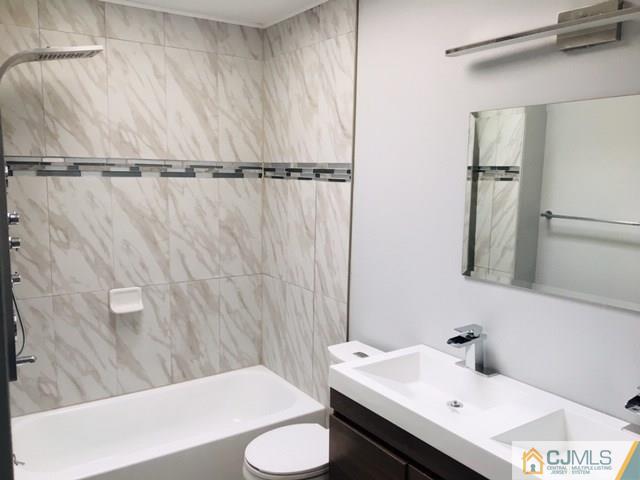 65 Old Post Road Edison, NJ 08817 - Photo 13 of 25 a bathroom with a sink and mirror